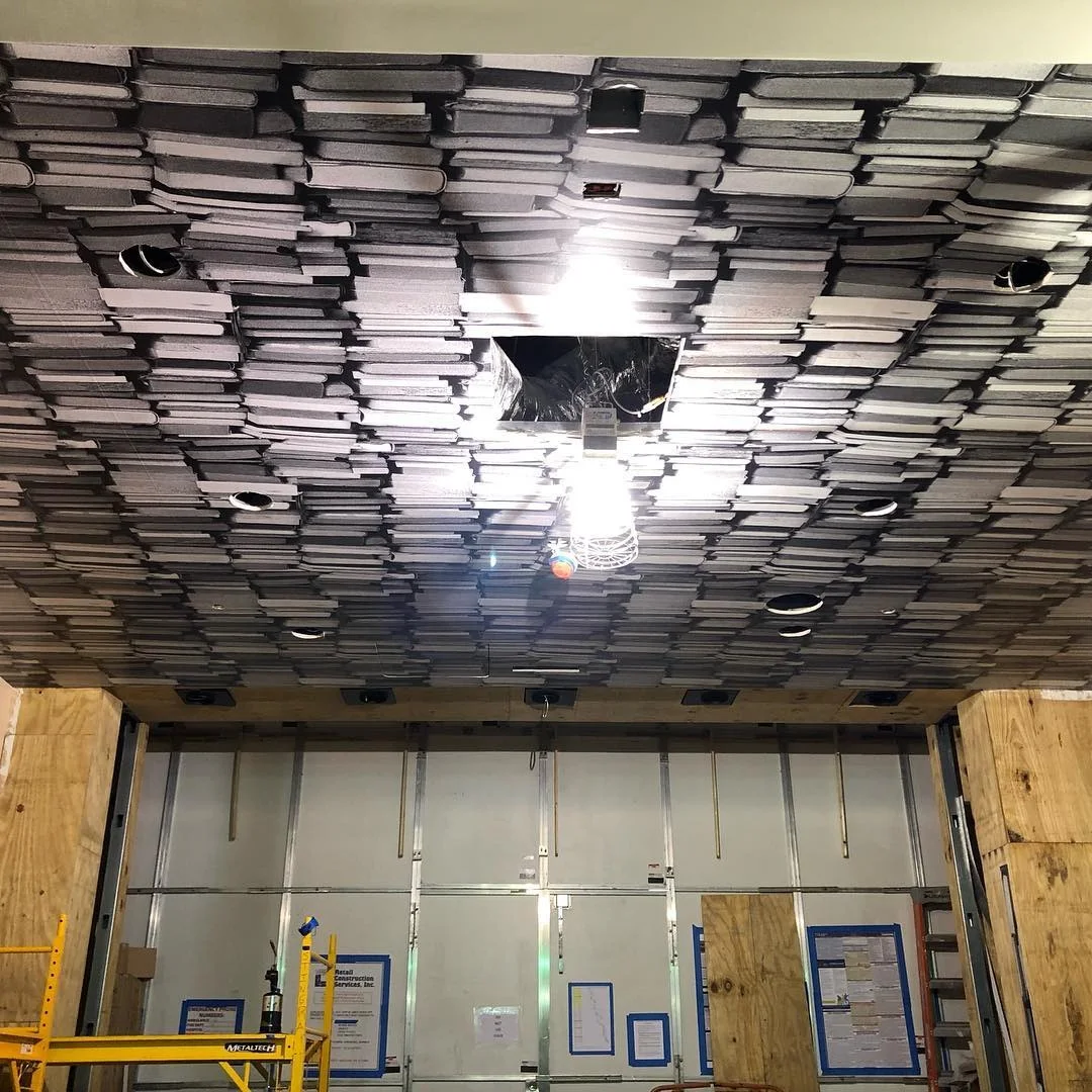 Book-Spine Ceiling Wrap In-Progress Install for Architectural Ceiling Wrap — Wall Murals & Interiors installed by Stingray Signs LLC