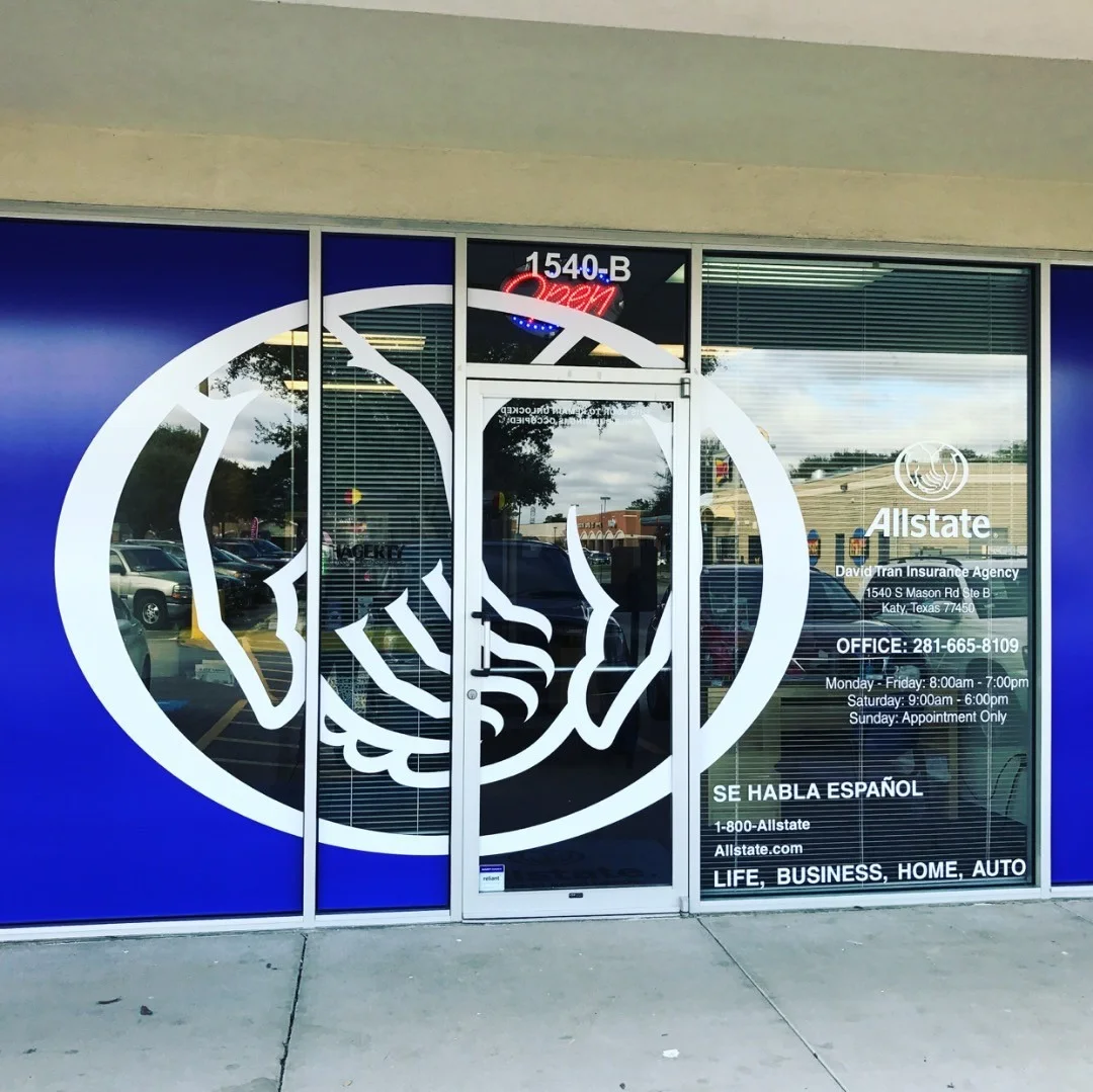 Allstate Insurance agency storefront blue perforated window vinyl wrap and bilingual contact graphics